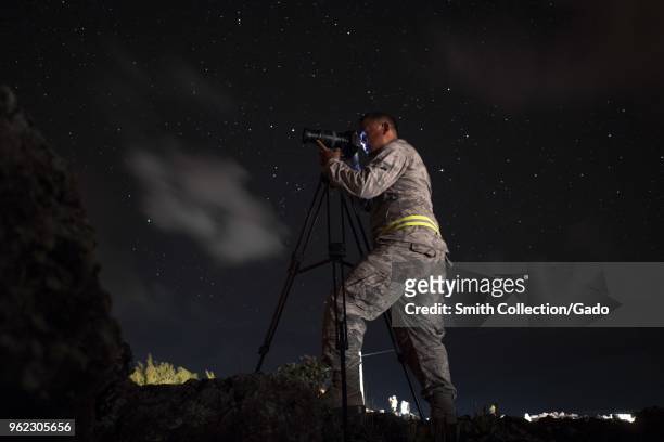 154th Wing Public Affairs broadcast journalist Senior Airman Orlando Corpuz documenting the ongoing volcanic outbreak at Leilani Estates, Pahoa,...