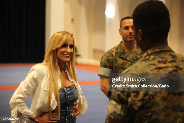 Photograph of former WWE wrestler Dana Warrior speaking with Marines during a tour of barracks in Washington DC, May 10, 2018.