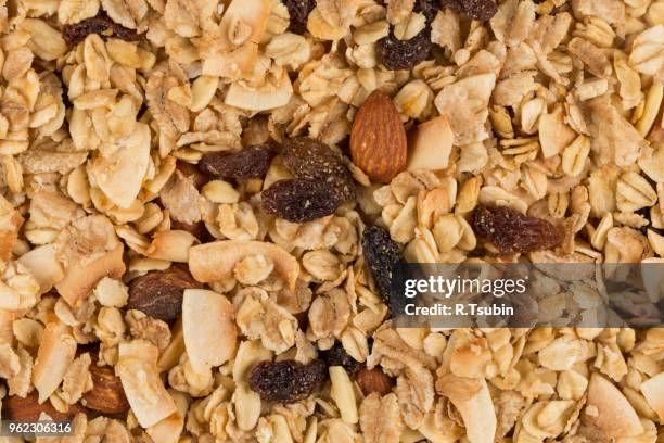 closeup of a pile of muesli cereal breakfast oatmeal - raisin bran stock pictures, royalty-free photos & images