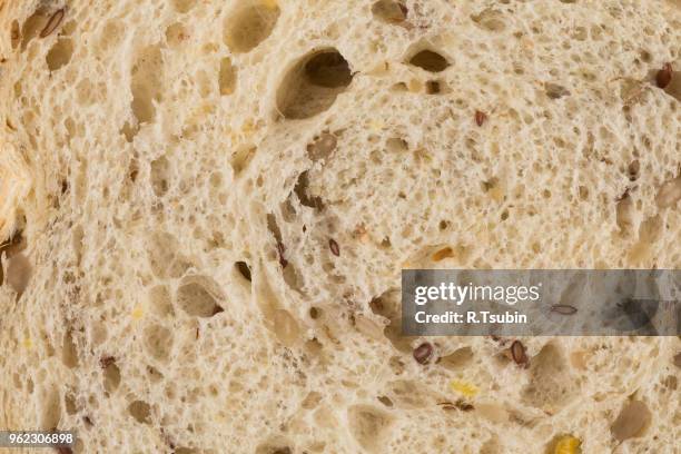 wheat bread with sunflower seeds close up photo - grain texture stock pictures, royalty-free photos & images