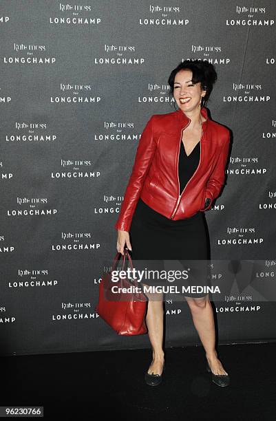 French sound designer Beatrice Ardisson poses as she arrives at the launch show of the line of bags designed by British Top model Kate Moss for...