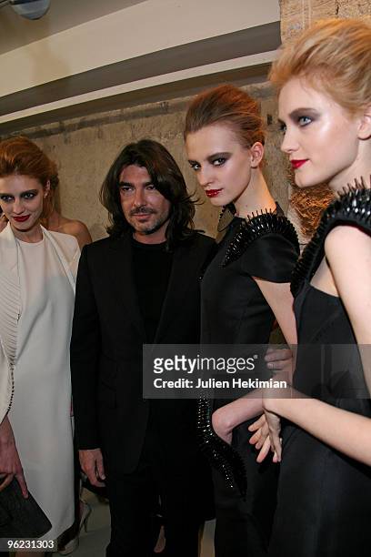 Designer Stephane Rolland poses backstage with models during the Stephane Rolland Haute Couture show as part of the Paris Fashion Week S/S 2010at...