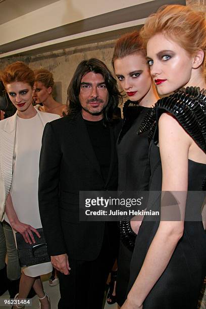 Designer Stephane Rolland poses backstage with models during the Stephane Rolland Haute Couture show as part of the Paris Fashion Week S/S 2010at...