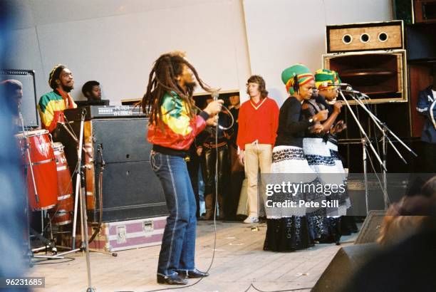 Bob Marley and The I-Threes perform on stage at Crystal Palace Bowl on June 7th, 1980 in London, United Kingdom.