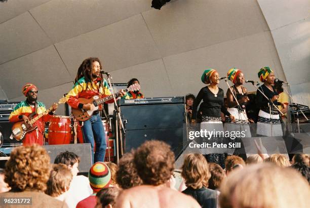 Aston 'Family Man' Barrett, Bob Marley and The I-Threes perform on stage at Crystal Palace Bowl on June 7th, 1980 in London, United Kingdom.