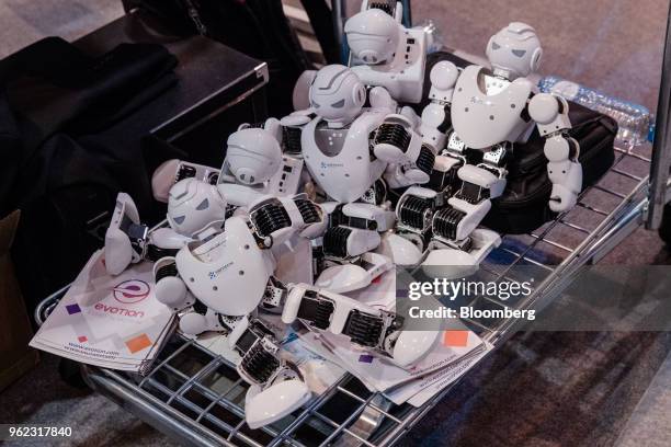 Evotion robots rest on a cart at the company's booth during the Viva Technology conference in Paris, France, on Thursday, May 24, 2018. Viva Tech, a...