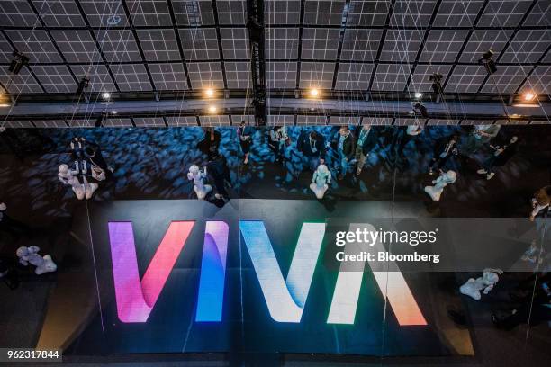 SoftBank Group Corp. Pepper humanoid robots welcome attendees during the Viva Technology conference in Paris, France, on Thursday, May 24, 2018. Viva...