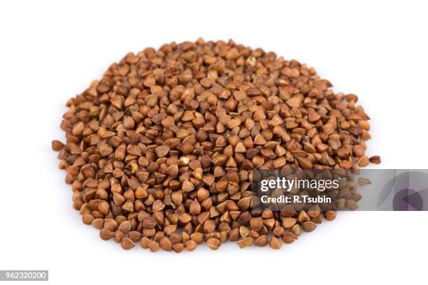 pile of buckwheat seeds isolated over the white background - buckwheat isolated stock pictures, royalty-free photos & images