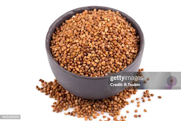 buckwheat groats in a bowl, close up photo - buckwheat isolated stock pictures, royalty-free photos & images