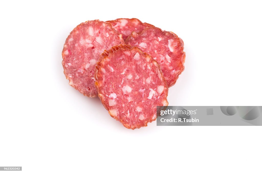 Slices of salami isolated on a white background