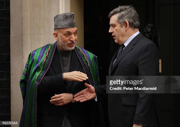 British Prime Minister Gordon Brown shakes hands with President Hamid Karzai of Afghanistan in Downing Street after a breakfast meeting on January...