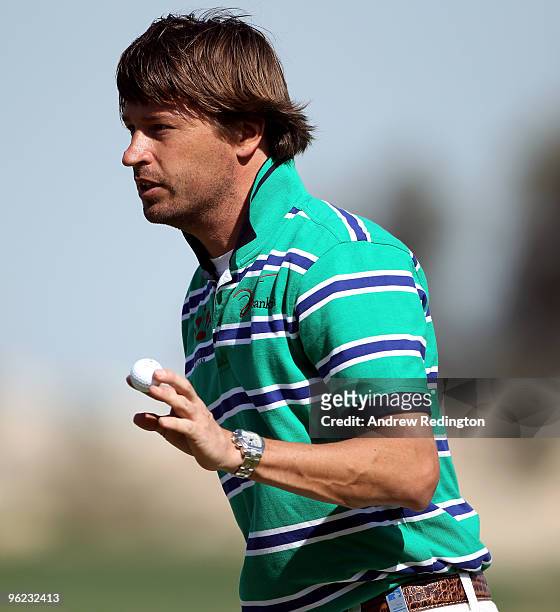 Robert Jan Derksen of The Netherlands waves to the crowd on the 18th hole during the first round of the Commercialbank Qatar Masters at Doha Golf...