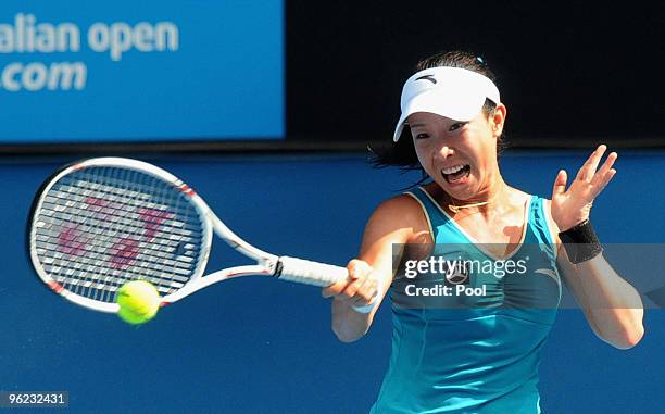 Jie Zheng of China plays a forehand in her semifinal match against Justine Henin of Belgium during day eleven of the 2010 Australian Open at...