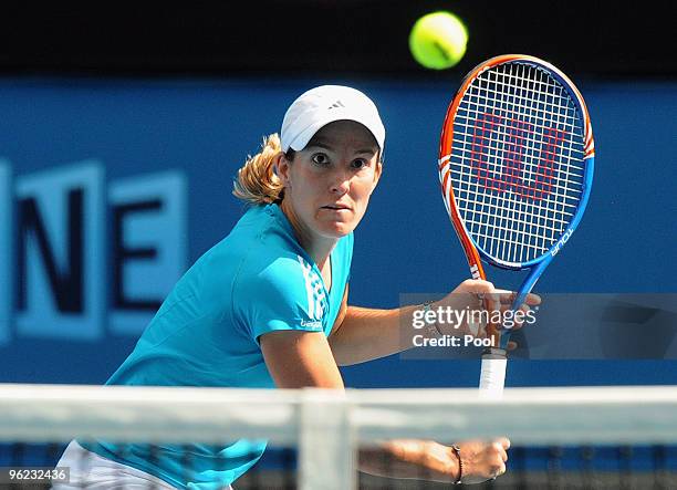 Justine Henin of Belgium plays a backhand in her semifinal match against Jie Zheng of China during day eleven of the 2010 Australian Open at...