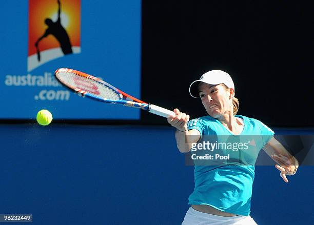 Justine Henin of Belgium plays a backhand in her semifinal match against Jie Zheng of China during day eleven of the 2010 Australian Open at...