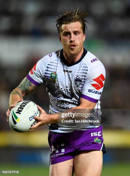 Cameron Munster of the Storm runs the ball during the round 12 NRL match between the North Queensland Cowboys and the Melbourne Storm at 1300SMILES...