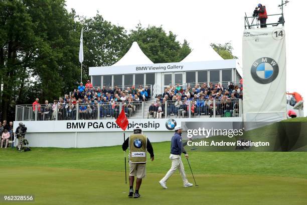 Branden Grace of South Africa acknowledges the crowd on the fourteenth during day two of the BMW PGA Championship at Wentworth on May 25, 2018 in...