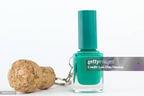 cava cork keyring holding green nail polish - cork stopper bildbanksfoton och bilder
