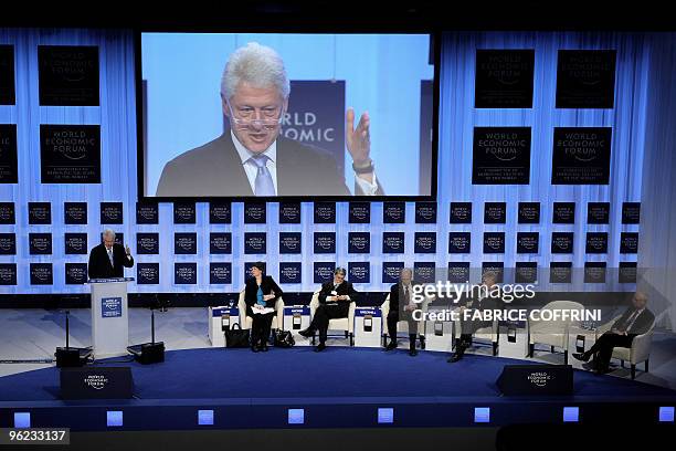 Former US President Bill Clinton addresses the assembly beside United Nations Development Programme Administrator Helen E. Clark, BrazilIan Minister...