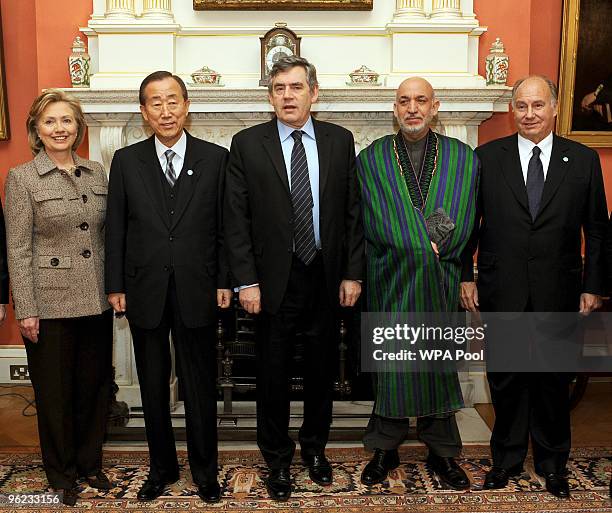 Britain's Prime Minister Gordon Brown poses with Hillary Clinton, Ban Ki Moon, Afghan President Hamid Karzai and Miguel Moratinos inside 10 Downing...