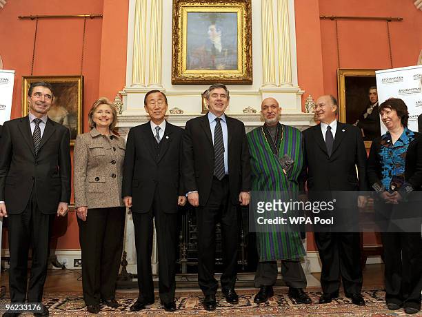 Britain's Prime Minister Gordon Brown poses with Anders Fogh Rasmussen, Hillary Clinton, Ban Ki Moon, Afghan President Hamid Karzai, Miguel Moratinos...