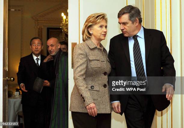 Britain's Prime Minister Gordon Brown arrives with Hillary Clinton for the media as Ban Ki Moon and Afghan President Hamid Karzai look-on inside 10...
