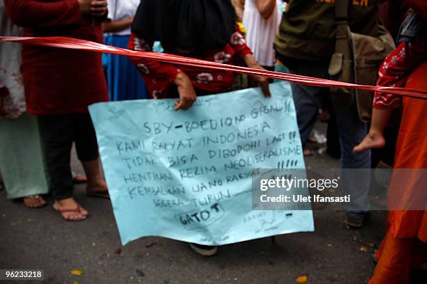 Indonesians stage a mass anti-government protest, as President Susilo Bambang Yudhoyono marks his 100th day in office, at Istana Merdeka on January...