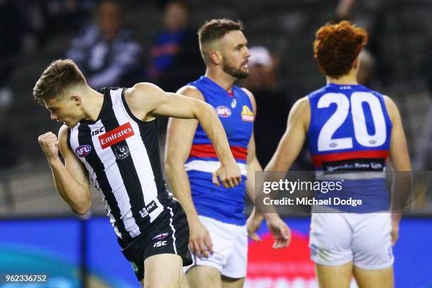 Josh Thomas of the Magpies celebrates a goal during the round 10 AFL match between the Collingwood Magpies and the Western Bulldogs at Etihad Stadium...