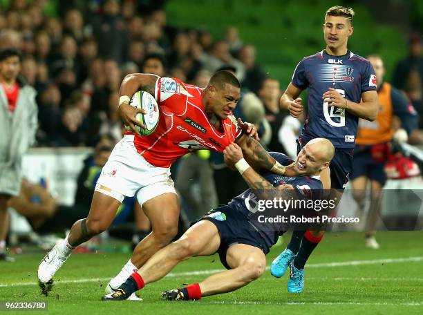 Lomano Lava Lemeki of the Sunwolves is tackled during the round 15 Super Rugby match between the Rebels and the Sunwolves at AAMI Park on May 25,...