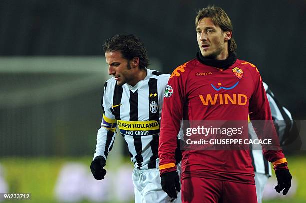 Roma's forward Francesco Totti looks on flanked by Juventus forward Alessandro Del Piero during the Serie A football match Juventus vs AS Roma at...