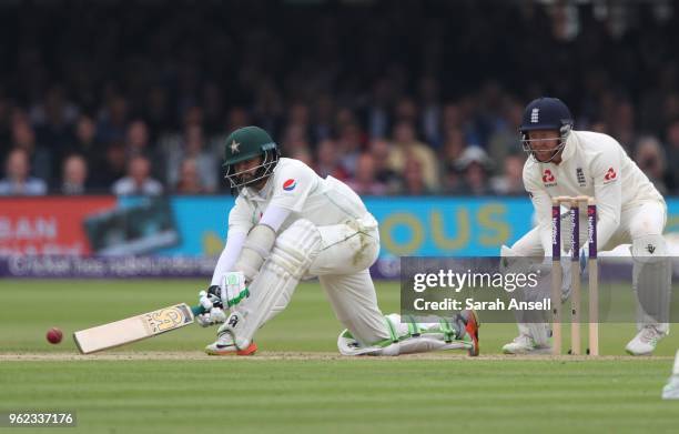 Azhar Ali of Pakistan attempts a sweep off the bowling of England's Dominic Bess as wicket keeper Jonny Bairstow looks on during day 2 of the First...
