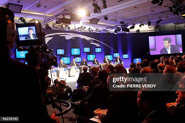 Participants attend the session "Global energy outlook", on the second day of the World Economic Forum meeting in Davos on January 28, 2010. Khalid...