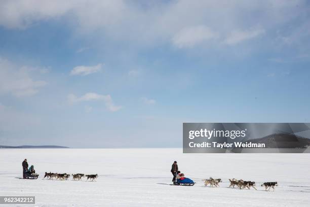 People participate in a dog sled race at the Lake Khovsgol Ice Festival in Khatgal, Mongolia.