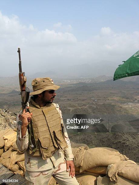 Saudi soldier stands in a military post atop the Jebel Doud in Al-Khouba in the southern Jizan province, near the border with Yemen, on January 27,...
