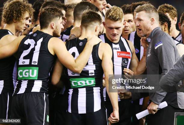 Magpies head coach Nathan Buckley speaks to his players at three quarter time during the round 10 AFL match between the Collingwood Magpies and the...