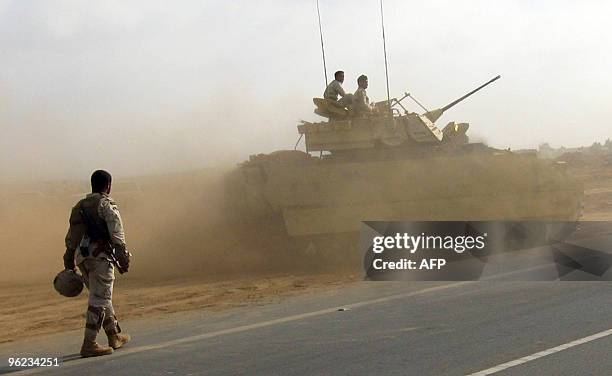 Saudi soldiers drive an army tank in Al-Khouba in the southern Jizan province, near the border with Yemen, on January 27, 2010. Saudi Major General...