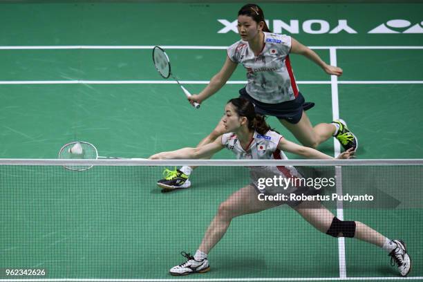 Misaki Matsutomo and Ayaka Takahashi of Japan compete against Baek Ha Na and Lee Yu Rim of Korea during the Semi-finals match on day six of the BWF...