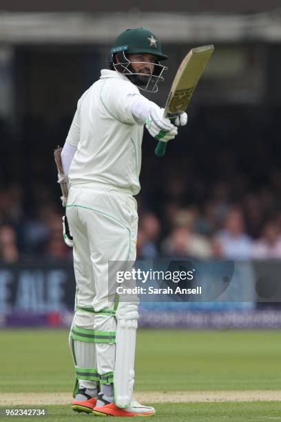 Azhar Ali of Pakistan raises his bat after reaching a half century on day 2 of the First NatWest Test match between England and Pakistan at Lord's...