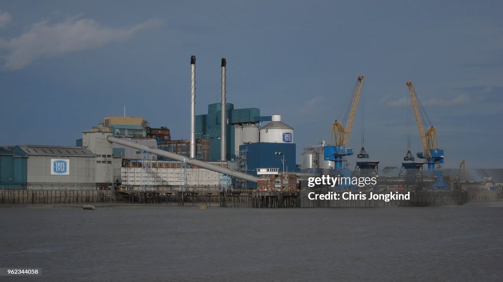 Factory and Cranes on a River