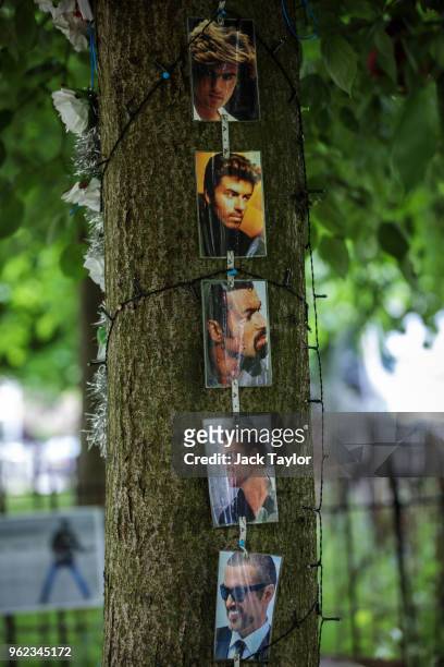 Tributes to the British musician George Michael sit outside his former home in an unofficial memorial garden in Highgate on May 25, 2018 in London,...