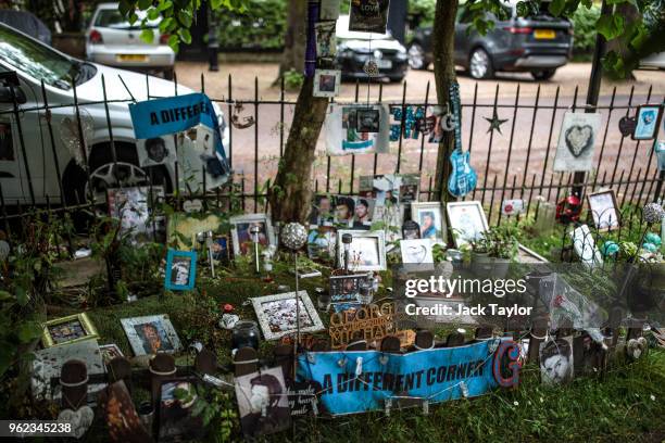 Tributes to the British musician George Michael sit outside his former home in an unofficial memorial garden in Highgate on May 25, 2018 in London,...