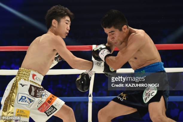 Japan's Ken Shiro and Mexico's Ganigan Lopez fight during their WBC world light flyweight title boxing bout in Tokyo on May 25, 2018.