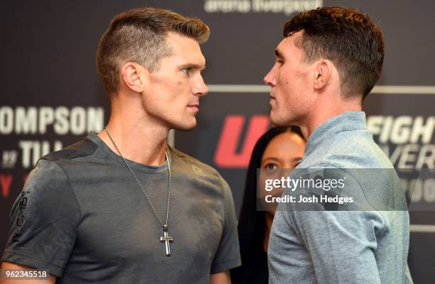 Opponents Stephen Thompson and Darren Till of England face off the UFC Ultimate Media Day at BT Convention Centre on May 25, 2018 in Liverpool,...