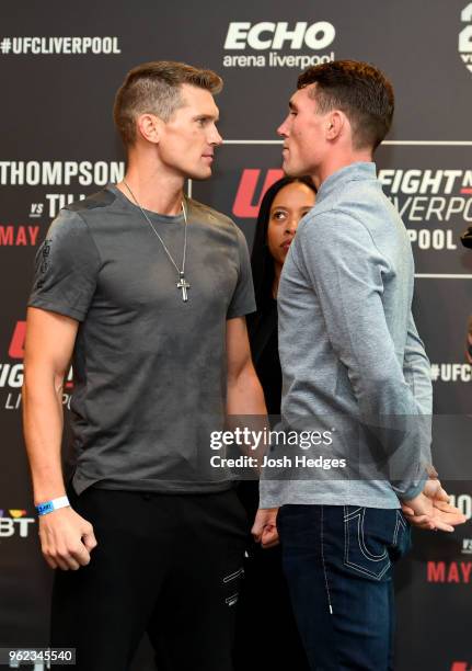 Opponents Stephen Thompson and Darren Till of England face off the UFC Ultimate Media Day at BT Convention Centre on May 25, 2018 in Liverpool,...