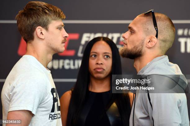 Opponents Arnold Allen of England and Mads Burnell of Denmark face off during the UFC Ultimate Media Day at BT Convention Centre on May 25, 2018 in...