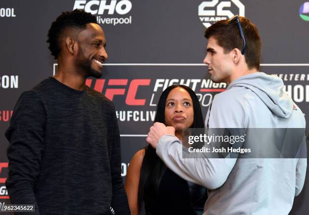 Opponents Neil Magny and Craig White of England face off during the UFC Ultimate Media Day at BT Convention Centre on May 25, 2018 in Liverpool,...