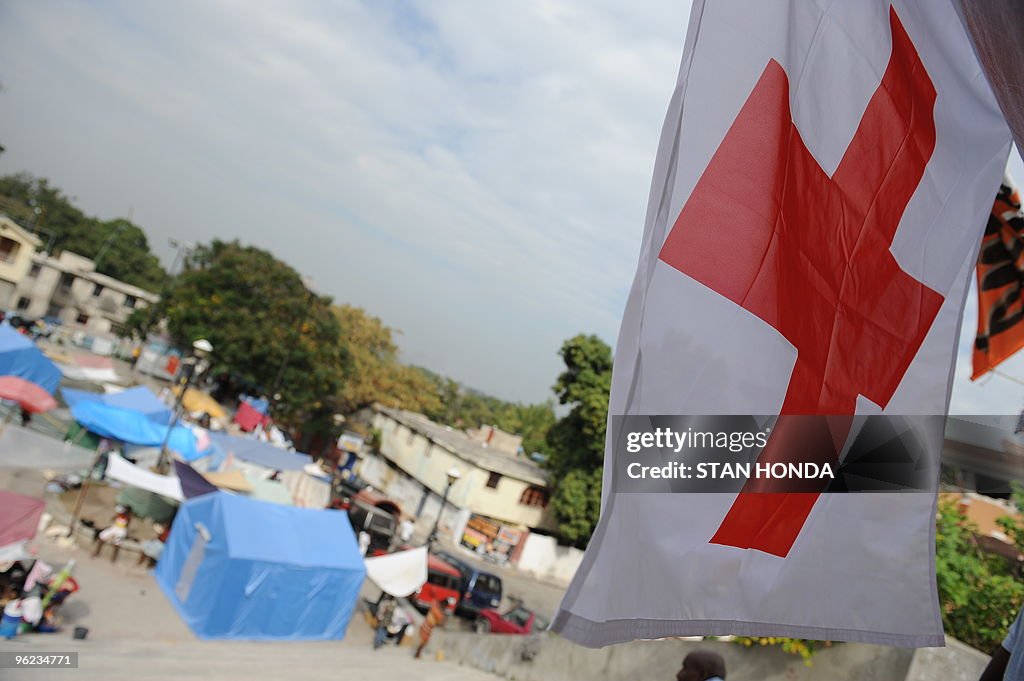 A flag flies at a Finnish Red Cross tent