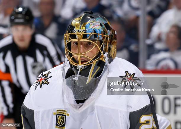 Goaltender Marc-Andre Fleury of the Vegas Golden Knights looks on during first period action against the Winnipeg Jets in Game Five of the Western...