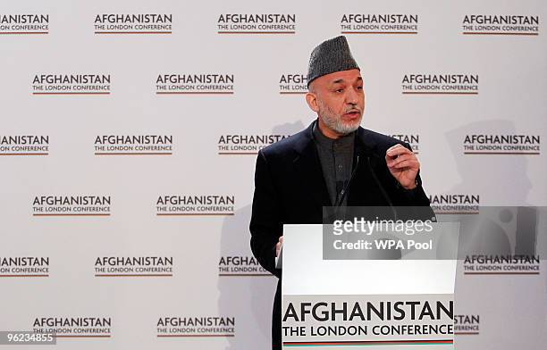 Afghan President Hamid Karzai speaks during the opening session of the Afghanistan Conference at Lancaster House on January 28, 2010 in London,...
