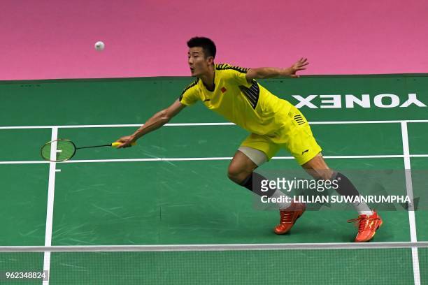 Chen Long of China hits a return against of Anthony Sinisuka Ginting of Indonesia during their men's singles semifinals match at the Thomas and Uber...